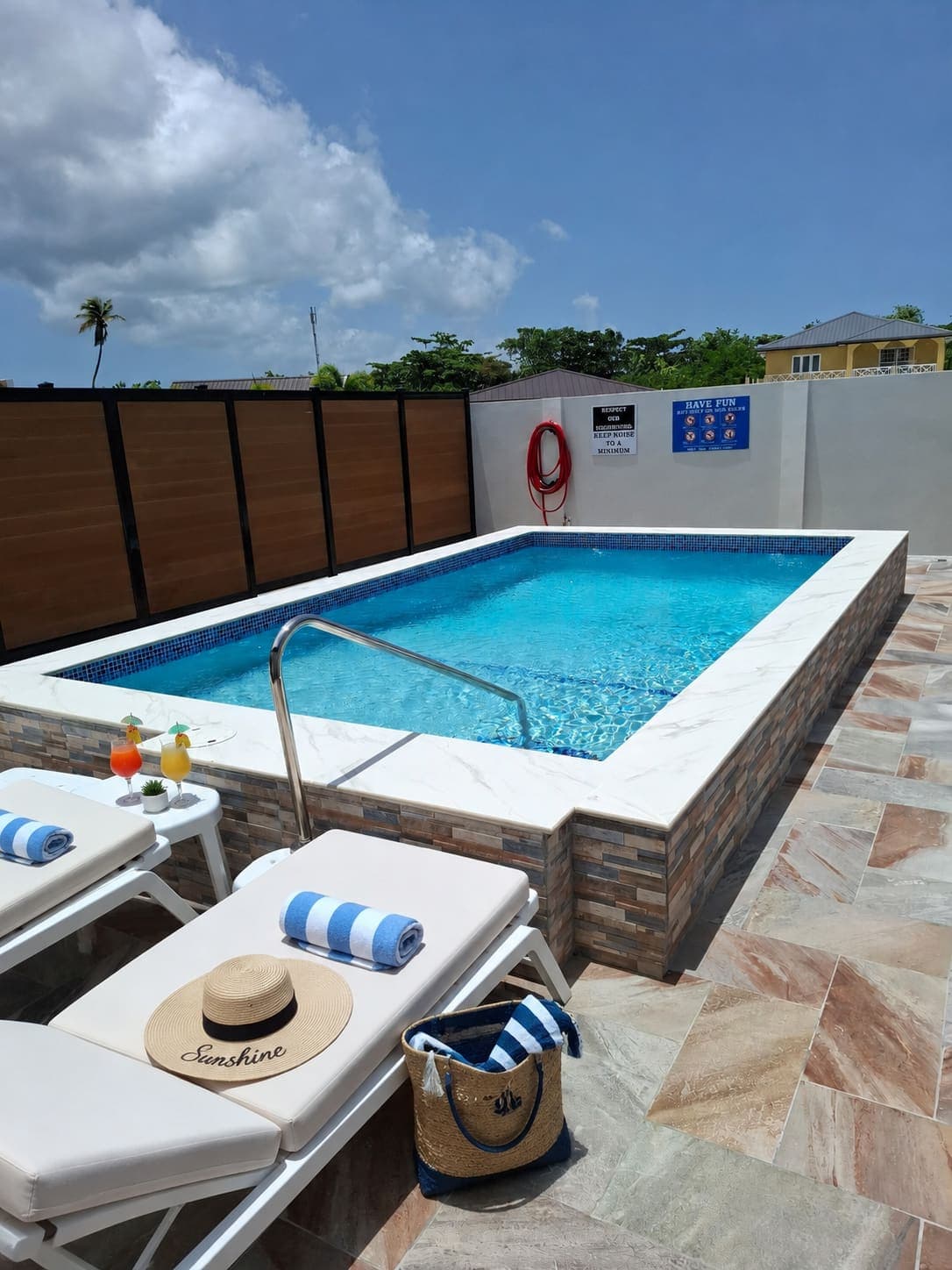 Poolside loungers set with towels and refreshments